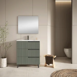 Mueble de baño Ezio con lavabo de porcelana y tres cajones con patas en negro, en verde, ambientado en baño