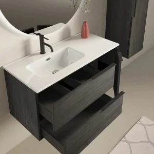 Conjunto mueble de baño suspendido Vulcano con lavabo porcelanico desplazado, con cajón abierto en negro