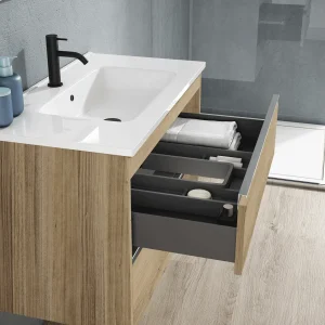Mueble de baño Slider dos cajones suspendido con lavabo porcelánico, con cajón abierto en madera