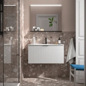 Mueble de baño Biba con un cajón y lavabo porcelánico, en blanco, ambientado en baño