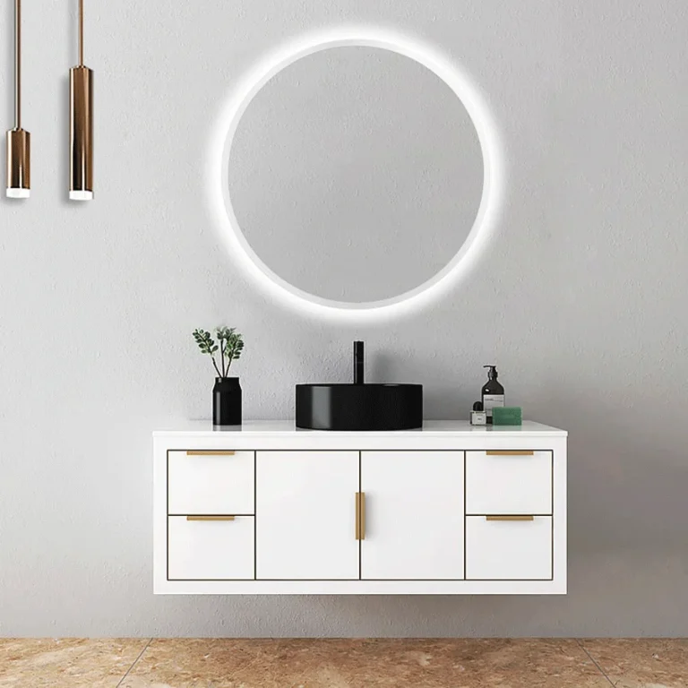 Espejo redondo Bélgica con luz LED fría y contorno arenado, sobre mueble blanco