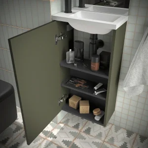 Conjunto de baño Marville con una puerta y lavabo micro de carga mineral, en verde, abierto con el interior visible