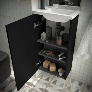 Conjunto de baño Marville con una puerta y lavabo micro de carga mineral, en negro, abierto con el interior visible