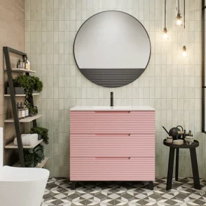 Mueble de baño Paris suspendido con 3 cajones y patas con lavabo porcelanico, en rosa, ambientado en baño