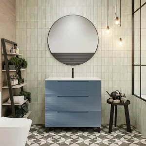 Mueble de baño Paris suspendido con 3 cajones y patas con lavabo porcelanico, en azul, ambientado en baño