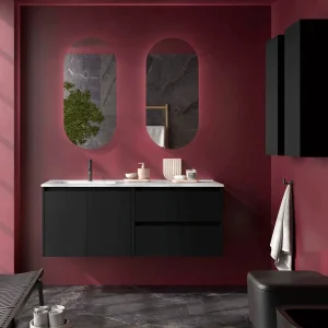 Conjunto de baño Noja 120 cm con 2 cajones, 2 puertas, lavabo desplazado y espejo incluido, en negro, ambientado en baño