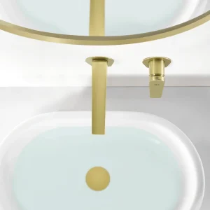 Grifo empotrado de lavabo monomando serie Delos de Imex, en dorado, ambientado en baño