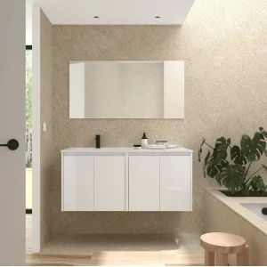 Conjunto de baño Noja 120 cm con 4 puertas, lavabo desplazado y espejo incluido, en blanco, ambientado en baño
