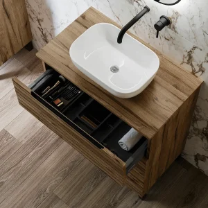 Mueble de baño Ruanda 3 cajones con patas y tapa para lavabo sobre encimera, con cajón abierto en madera