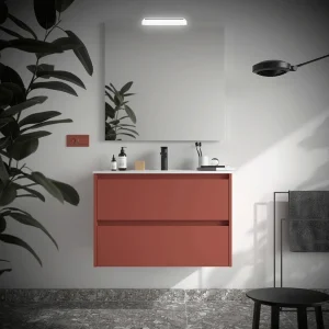 Mueble de baño suspendido Noja con 2 cajones y lavabo de porcelana, en coral, ambientado en baño