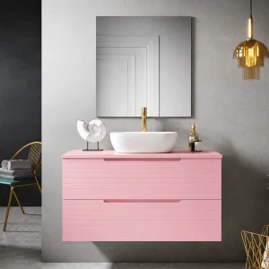Mueble de baño Paris suspendido con 2 cajones y tapa para lavabo sobre encimera, en rosa, ambientado en baño